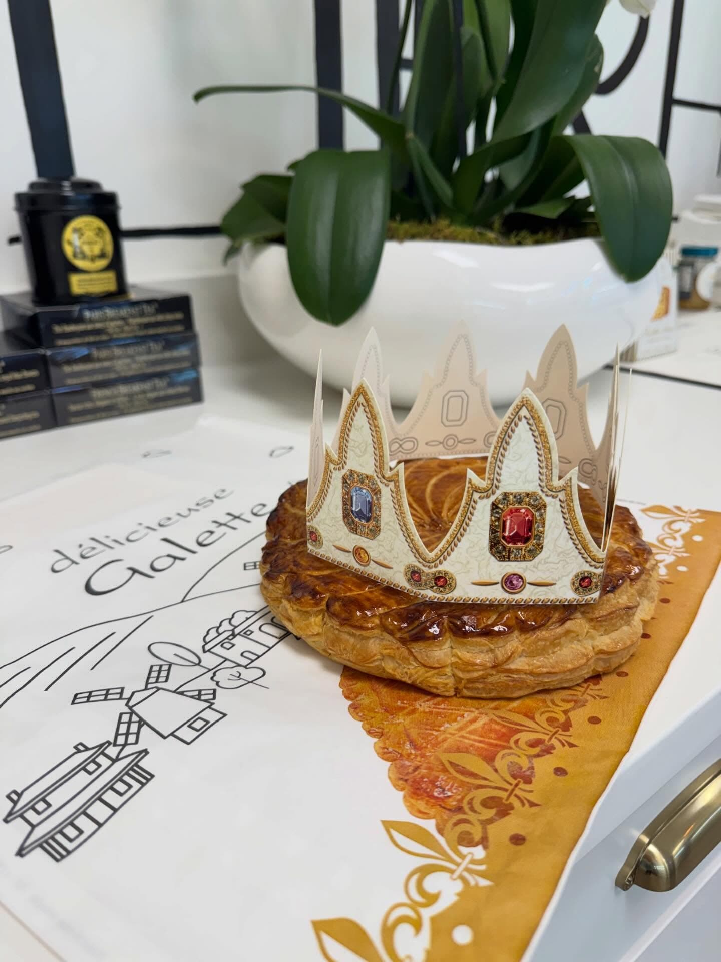 Traditional French galette des rois topped with a paper crown